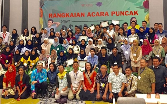 youth people and programme managers posing for a photo with the award